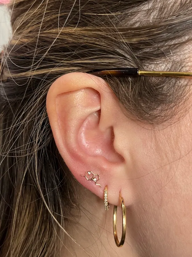 Her Studio Piercings