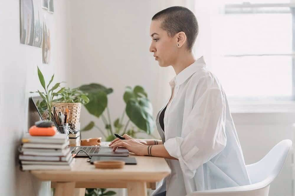 Woman typing at computer