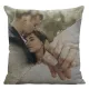 Double-sided decorative pillow featuring a romantic embrace and intertwined hands with matching rings.
