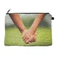 Stylish Unity Pouch featuring hands symbolizing affection and connection in a vibrant design.